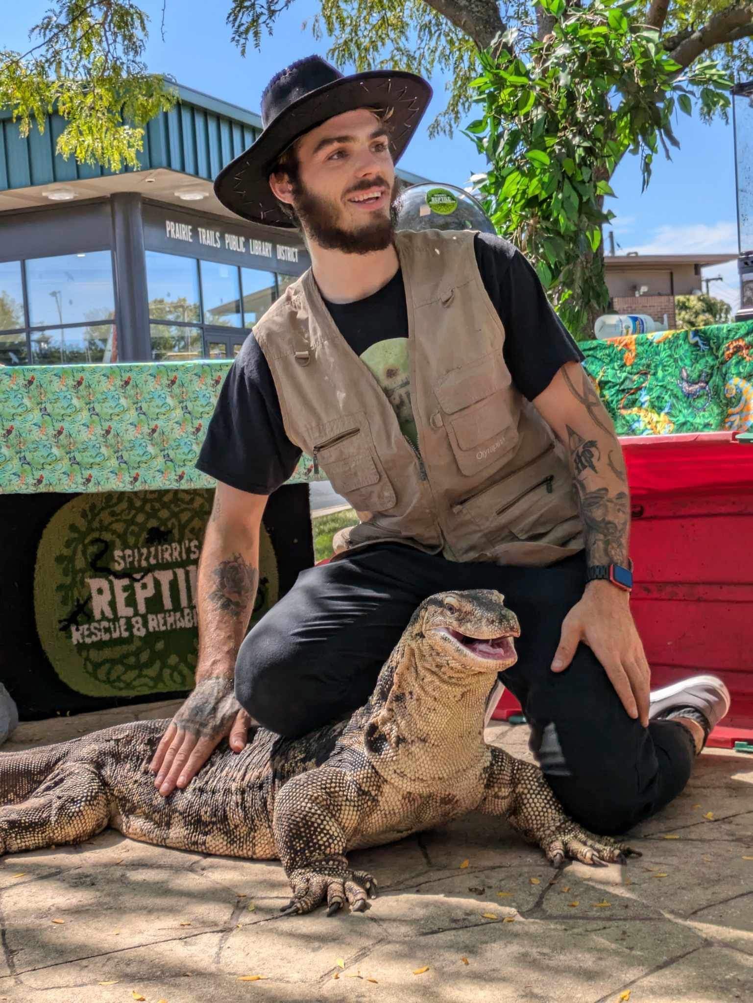 Niko posing with a large lizard.